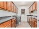 Laundry room with wood cabinets and a washer and dryer at 5713 W Rowel Rd, Phoenix, AZ 85083
