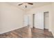 Bright bedroom with wood-look floors and double door closet at 5713 W Rowel Rd, Phoenix, AZ 85083