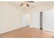 Well-lit bedroom with wood-look floors and a double door closet at 5713 W Rowel Rd, Phoenix, AZ 85083