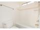 Clean bathroom with tub, shower, and window at 5713 W Rowel Rd, Phoenix, AZ 85083