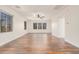 Open bonus room with wood-look floors and a ceiling fan at 5713 W Rowel Rd, Phoenix, AZ 85083