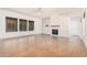 Living room with hardwood floors, fireplace, and large windows at 5713 W Rowel Rd, Phoenix, AZ 85083