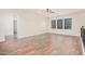 Bright bonus room featuring wood-look floors and multiple windows at 5713 W Rowel Rd, Phoenix, AZ 85083