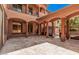 Elegant courtyard with arched columns and gated entry at 5713 W Rowel Rd, Phoenix, AZ 85083