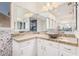 Elegant bathroom with a large vanity, modern fixtures, and a walk-in shower at 5713 W Rowel Rd, Phoenix, AZ 85083