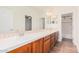 Bathroom with double vanity and wood cabinets at 5713 W Rowel Rd, Phoenix, AZ 85083