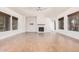 Spacious living room featuring a fireplace and wood-look tile floors at 5713 W Rowel Rd, Phoenix, AZ 85083