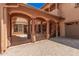Courtyard entry with arched gate and stone flooring at 5713 W Rowel Rd, Phoenix, AZ 85083