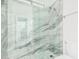 Modern bathroom with a glass shower and marble tile at 5713 W Rowel Rd, Phoenix, AZ 85083