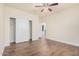 Charming bedroom with wood-look floors and sliding door closet at 5713 W Rowel Rd, Phoenix, AZ 85083