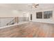 Spacious bonus room with wood-look floors and ceiling fan at 5713 W Rowel Rd, Phoenix, AZ 85083