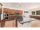 Large kitchen with island, double ovens, and ample counter space at 5713 W Rowel Rd, Phoenix, AZ 85083