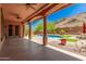 Covered patio with pool access and ceiling fans at 5713 W Rowel Rd, Phoenix, AZ 85083