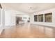 Open concept living area with hardwood floors and kitchen views at 5713 W Rowel Rd, Phoenix, AZ 85083