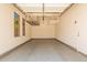 Garage with overhead storage and wall cabinets at 5713 W Rowel Rd, Phoenix, AZ 85083