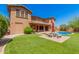 Large backyard with grassy area and patio, providing ample outdoor space at 5713 W Rowel Rd, Phoenix, AZ 85083