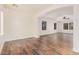 Bonus room with wood-look floors, arched entryway, and multiple windows at 5713 W Rowel Rd, Phoenix, AZ 85083