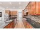 Modern kitchen with dark countertops and stainless steel appliances at 5713 W Rowel Rd, Phoenix, AZ 85083