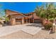Two-story home with a large driveway and landscaping at 5713 W Rowel Rd, Phoenix, AZ 85083