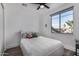 Bright bedroom with a double bed and large window at 3130 S Valle Verde Cir, Mesa, AZ 85212
