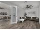 Cozy sitting room with L-shaped sectional and hardwood floors at 3130 S Valle Verde Cir, Mesa, AZ 85212