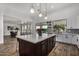 Modern kitchen with large island and open floor plan at 3130 S Valle Verde Cir, Mesa, AZ 85212