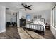 Spacious main bedroom with a fireplace and metal-framed bed at 3130 S Valle Verde Cir, Mesa, AZ 85212
