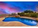 Beautiful kidney shaped pool with a waterfall feature at 3130 S Valle Verde Cir, Mesa, AZ 85212