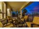 Relaxing patio with yellow chairs and a view of the backyard at 3130 S Valle Verde Cir, Mesa, AZ 85212