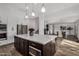 Modern kitchen with large island and open floor plan at 3130 S Valle Verde Cir, Mesa, AZ 85212
