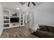 Home theater with built-in shelving and a comfortable sofa at 3130 S Valle Verde Cir, Mesa, AZ 85212