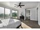 Main bedroom with large windows, balcony access, and ensuite bathroom at 3130 S Valle Verde Cir, Mesa, AZ 85212