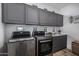 Laundry room with LG washer and dryer, and ample cabinet space at 3130 S Valle Verde Cir, Mesa, AZ 85212
