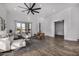 Open living area with hardwood floors and a ceiling fan at 3130 S Valle Verde Cir, Mesa, AZ 85212