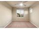 Bright bedroom with neutral walls and ceiling fan at 4424 E Hartford Ave, Phoenix, AZ 85032