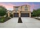 Two-story house with two-car garage and landscaped front yard at 4424 E Hartford Ave, Phoenix, AZ 85032