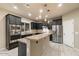 Modern kitchen with stainless steel appliances and granite countertops at 4424 E Hartford Ave, Phoenix, AZ 85032