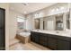 Bathroom features a soaking tub, double vanity, and tile flooring at 4424 E Hartford Ave, Phoenix, AZ 85032