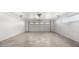 Garage with overhead door and concrete flooring at 7012 N 22Nd St, Phoenix, AZ 85020