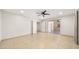 Bright bedroom with ceiling fan and sliding glass doors to patio at 7012 N 22Nd St, Phoenix, AZ 85020