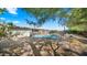 Relaxing pool area partially shaded by a tree at 7012 N 22Nd St, Phoenix, AZ 85020