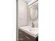 Small bathroom with a round mirror and modern sink at 7012 N 22Nd St, Phoenix, AZ 85020