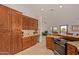 Spacious kitchen with wood cabinets and granite countertops at 2585 W Pinto Pl, Wickenburg, AZ 85390