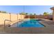 Refreshing rectangular pool with a ladder and spacious deck at 2585 W Pinto Pl, Wickenburg, AZ 85390