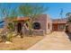 Spanish-style home with a terracotta roof, landscaping, and a driveway at 1514 E Diamond St, Phoenix, AZ 85006