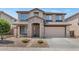 Two-story house with stone accents and a two-car garage at 3437 W Thoreau Ln, Anthem, AZ 85086