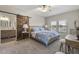 Main bedroom with a barn door leading to the ensuite bathroom at 20121 N 76Th N St # 2051, Scottsdale, AZ 85255