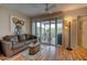 Living room with patio access and a cozy seating area at 10978 W Coggins Dr, Sun City, AZ 85351