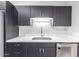Updated kitchen with white countertops and dark cabinets at 6116 N 12Th Pl # 7, Phoenix, AZ 85014