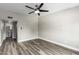 Bedroom with wood-look floors, ceiling fan and bathroom access at 6116 N 12Th Pl # 7, Phoenix, AZ 85014
